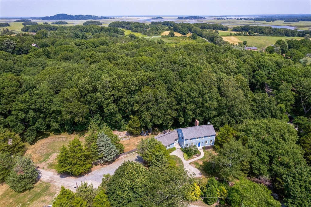 an aerial view of a house with a yard