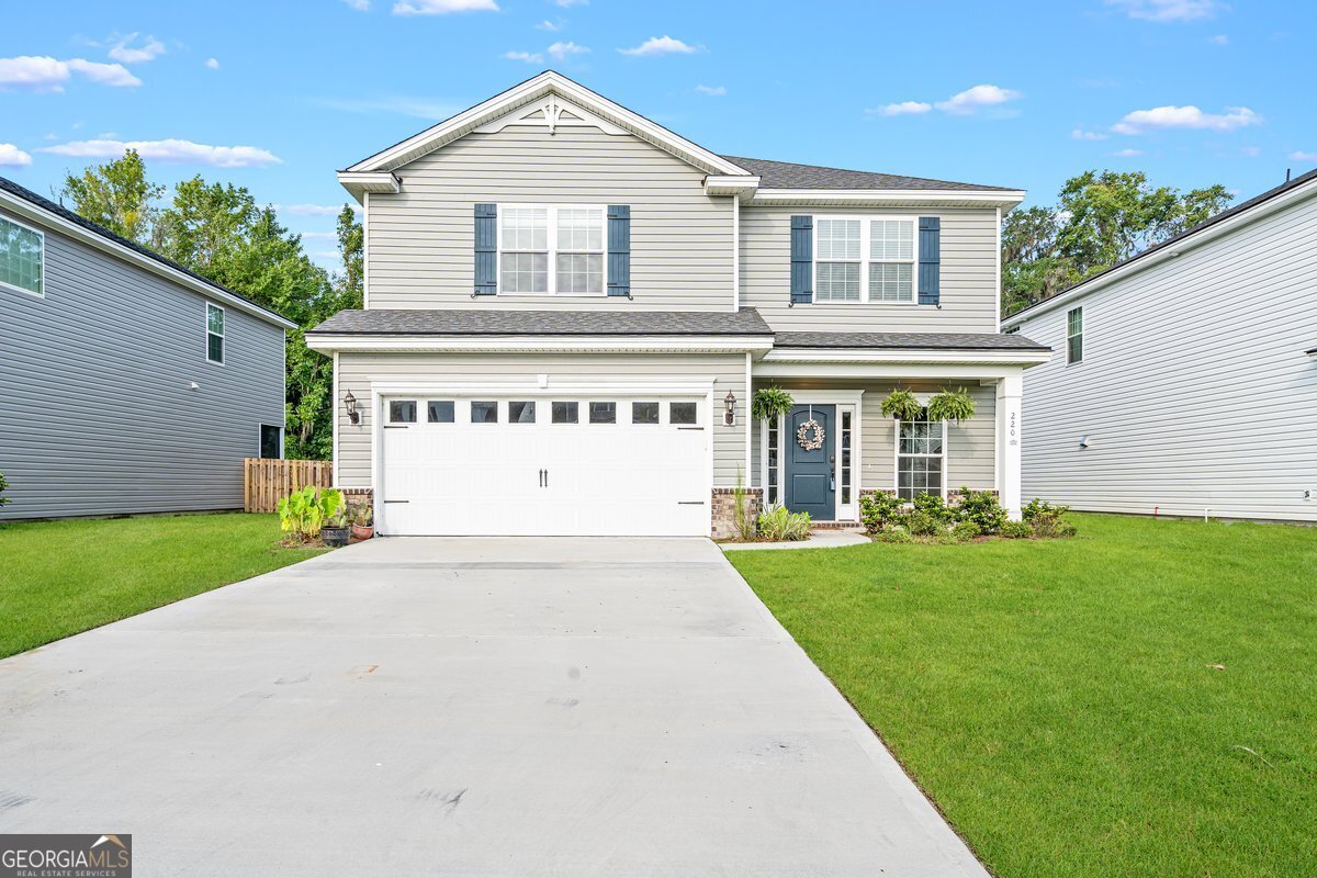 front view of a house with a yard