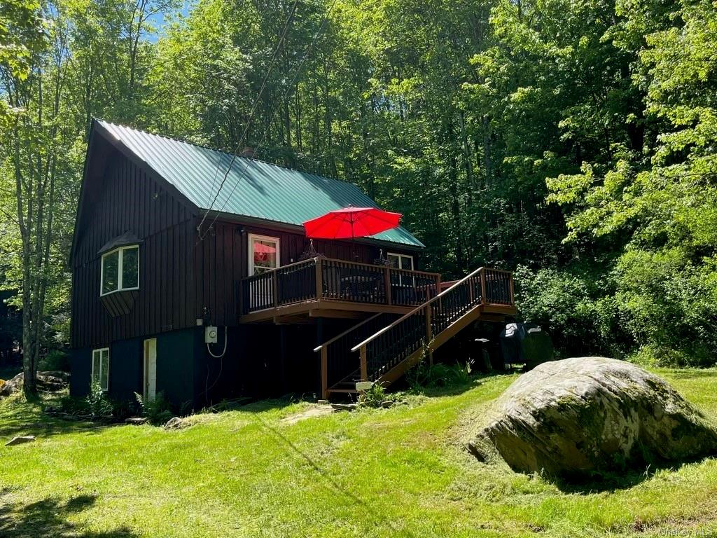 a view of backyard with a car parked