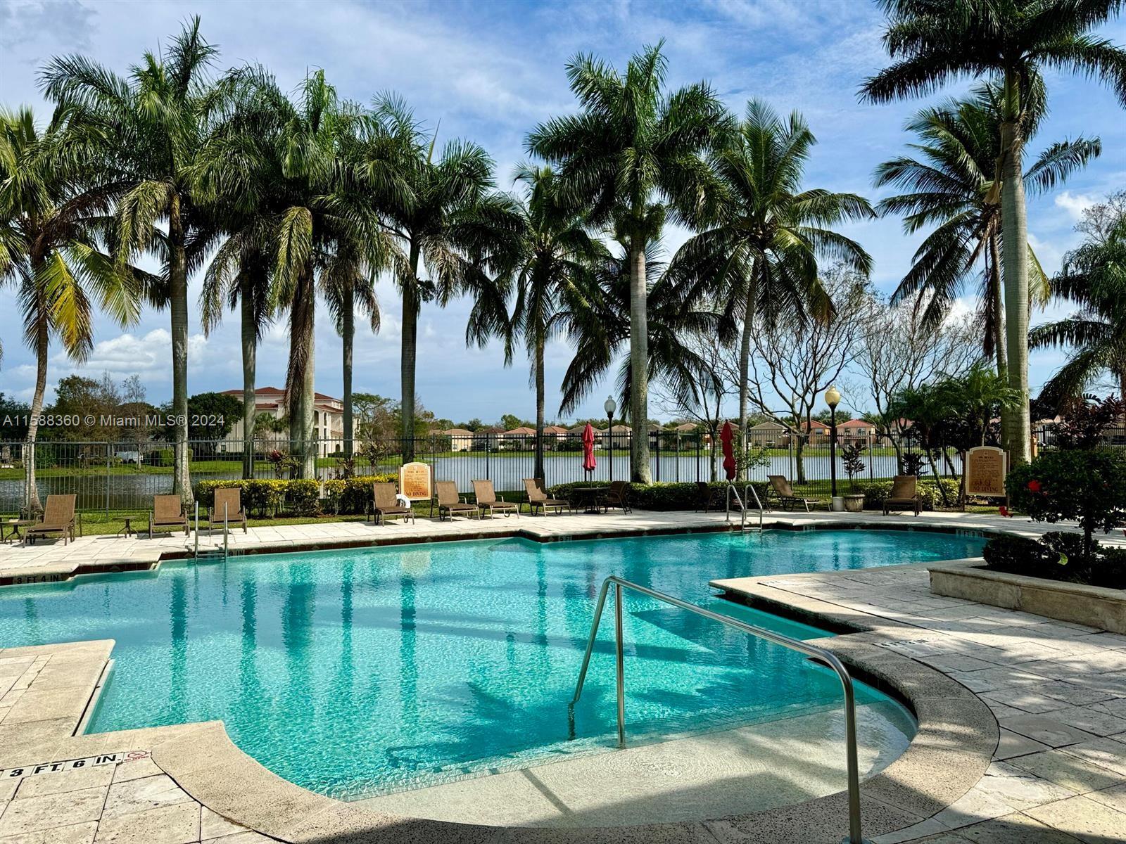 a view of a swimming pool and lounge chair