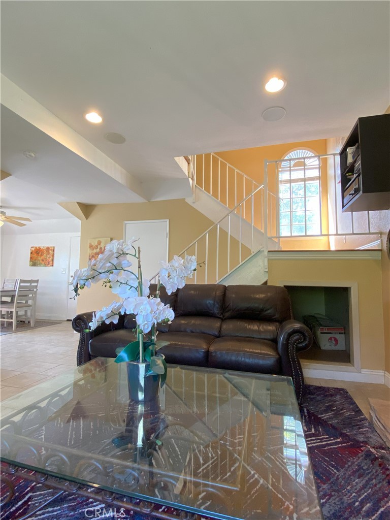 a living room with furniture fireplace and flat screen tv