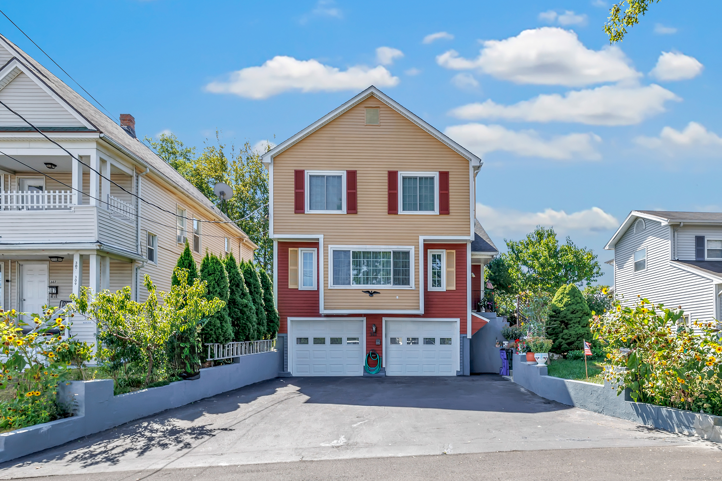 a front view of a house with a yard