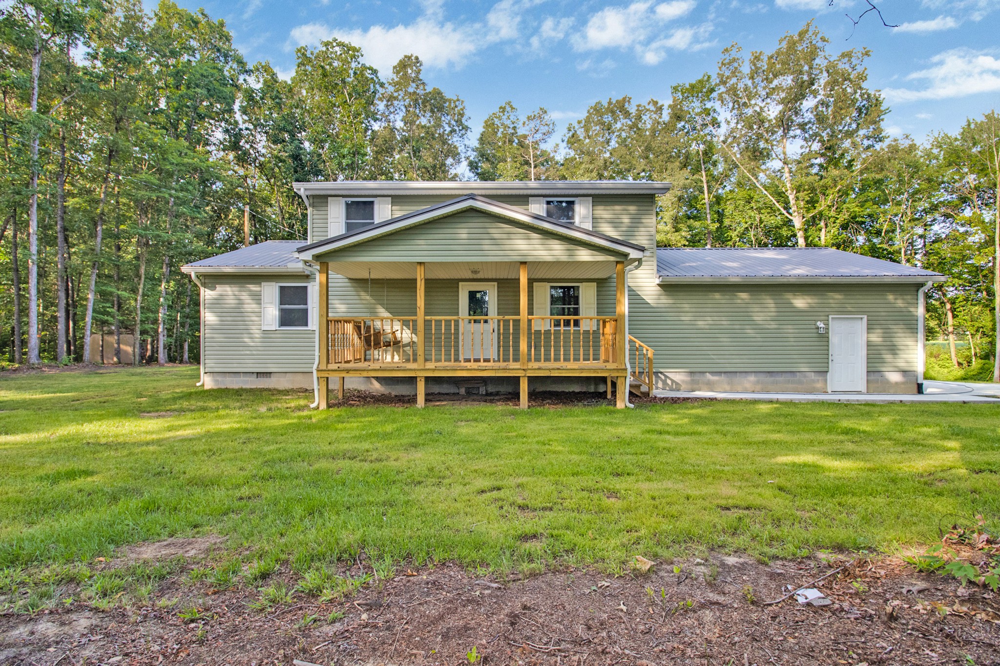 a view of a house with a backyard