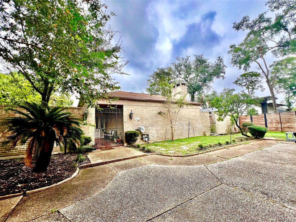 a view of backyard with a patio