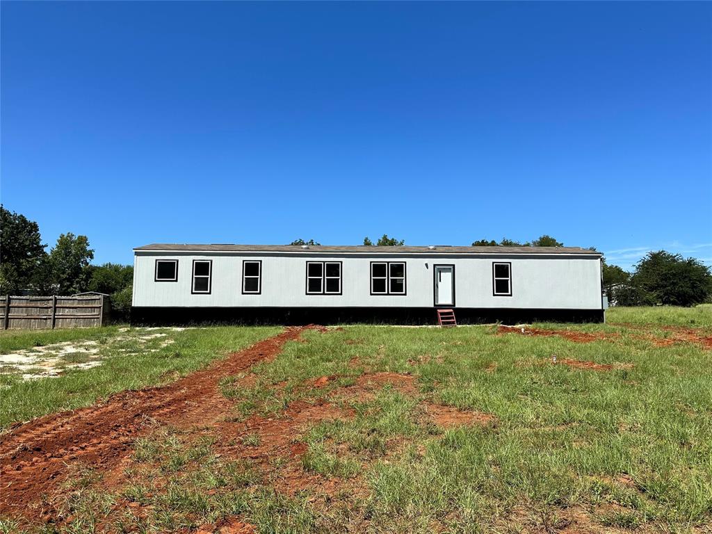 a view of a house with a big yard