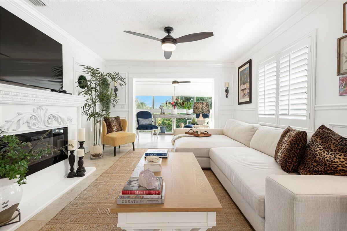 a living room with furniture fireplace and flat screen tv