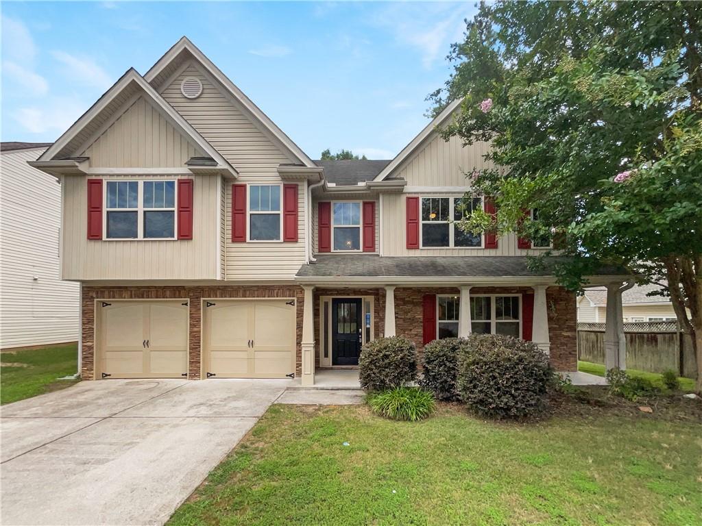 a front view of a house with a yard