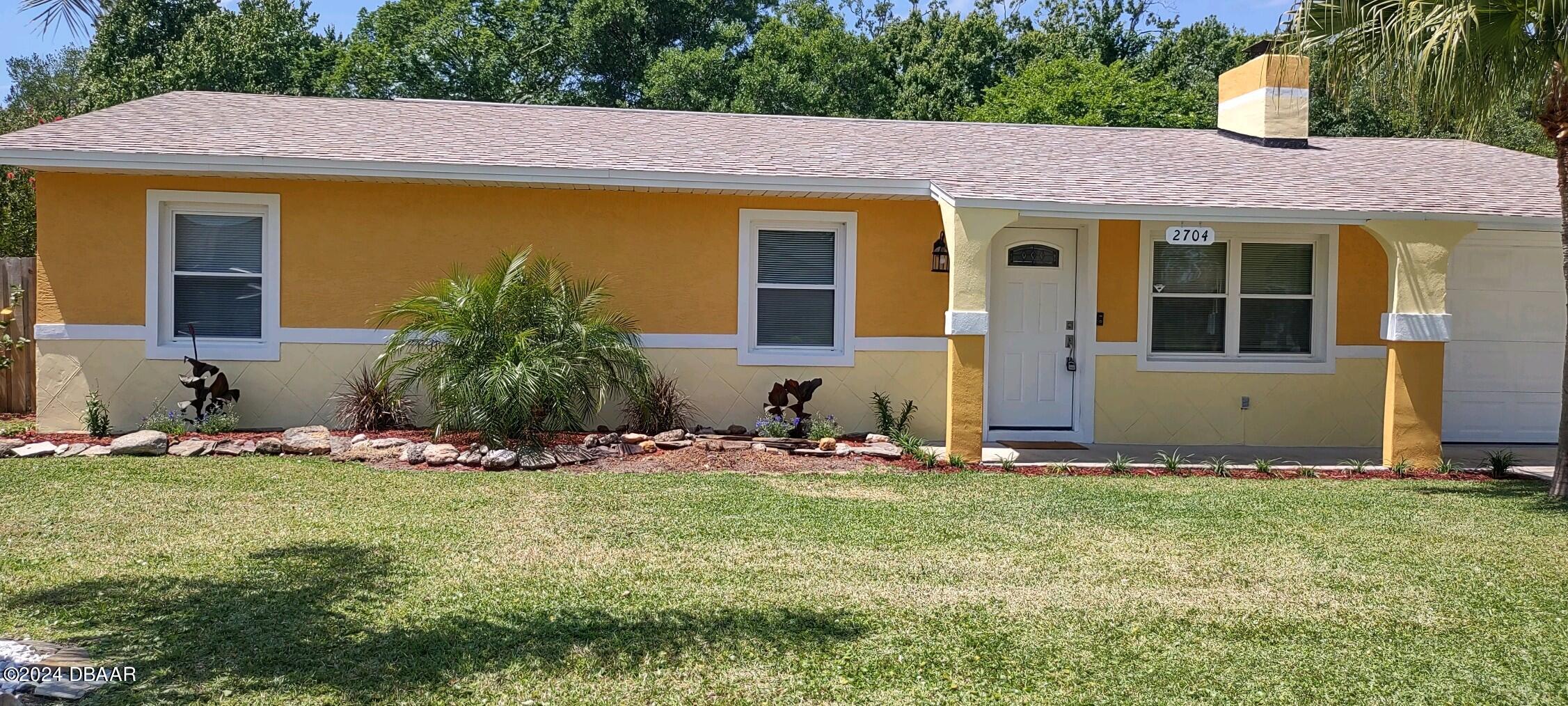 a front view of house with yard