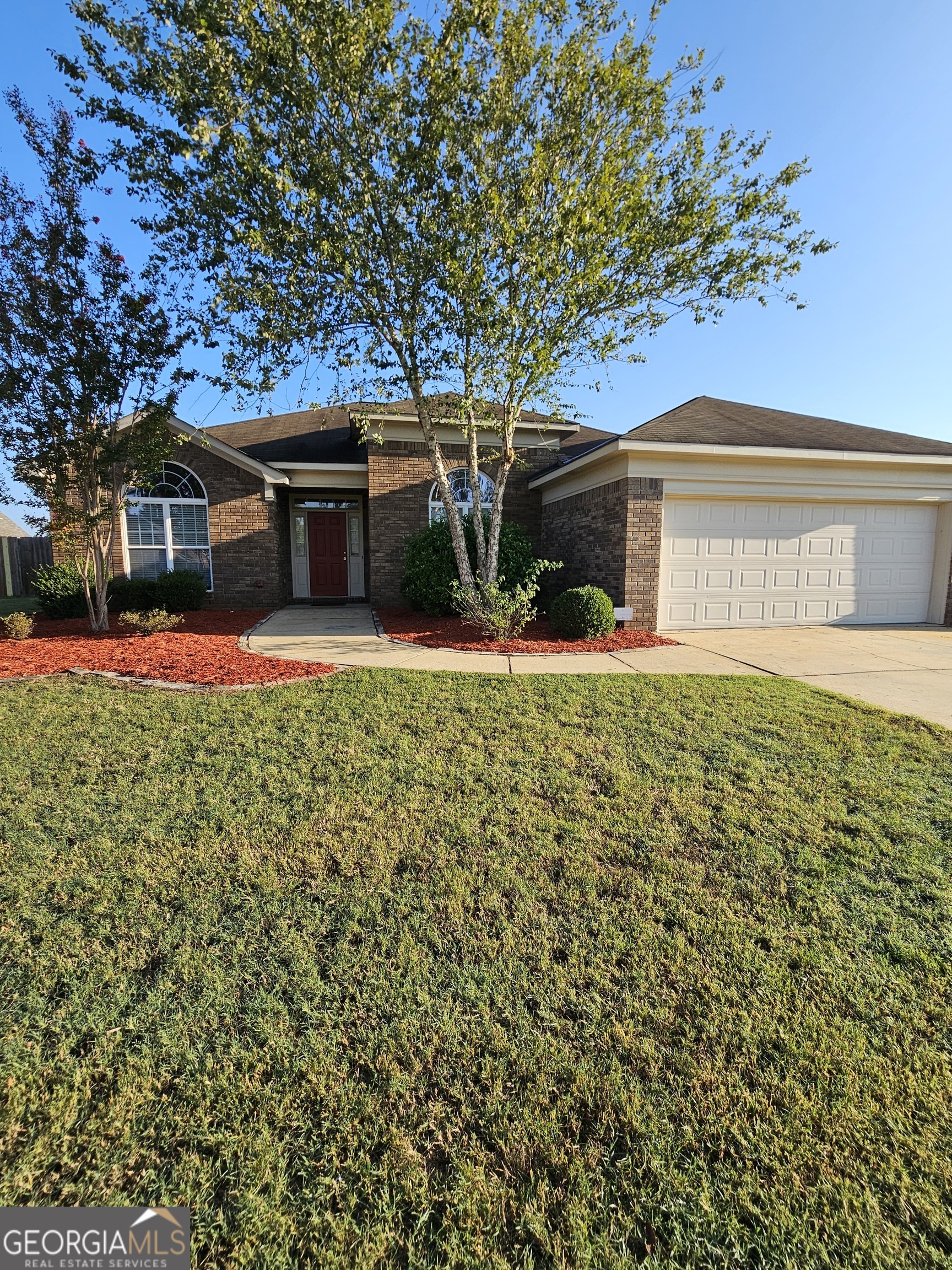 front view of a house with a yard