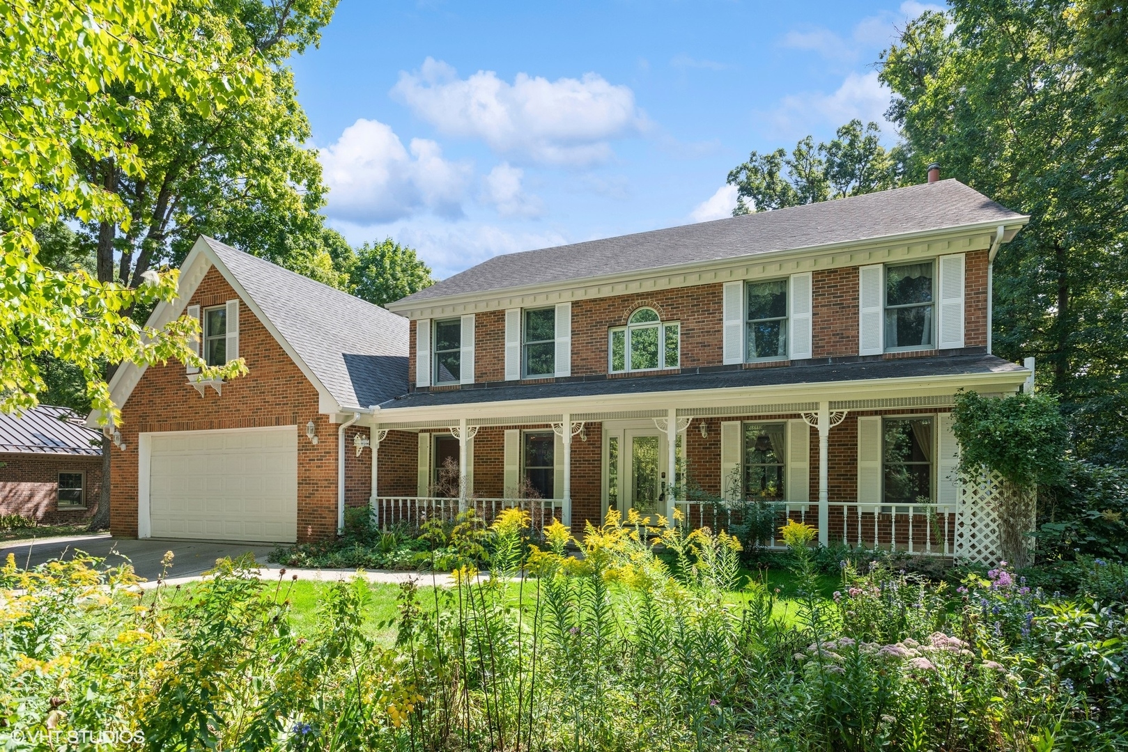 front view of a house with a yard