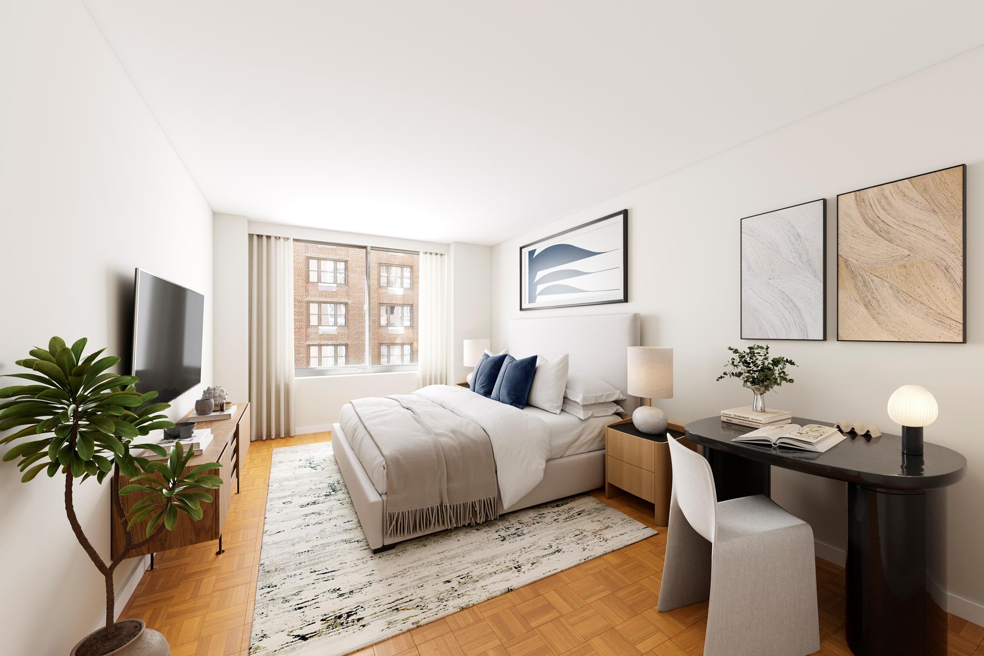 a bedroom with a large bed and a potted plant