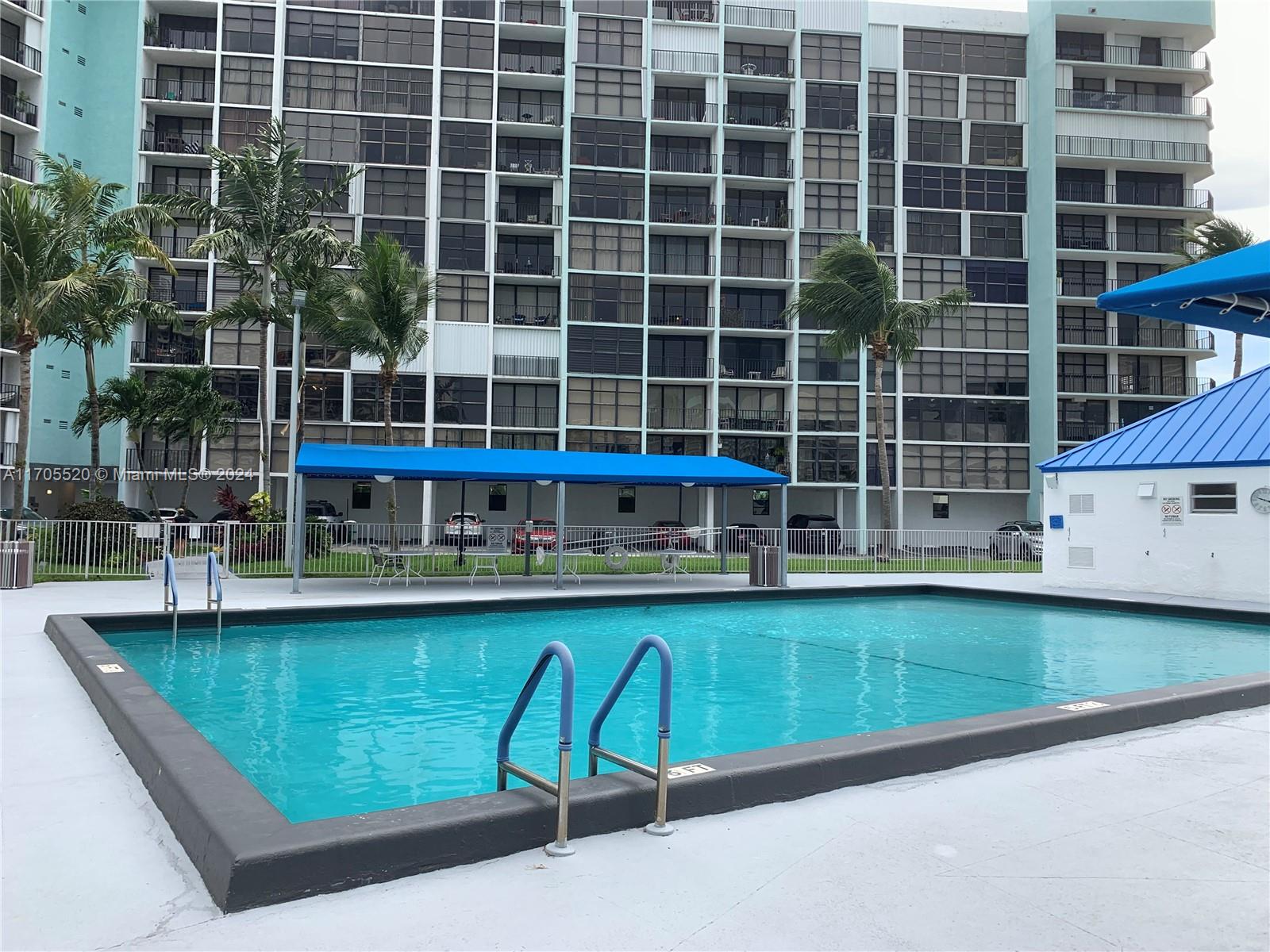 a view of a swimming pool with a lounge chair