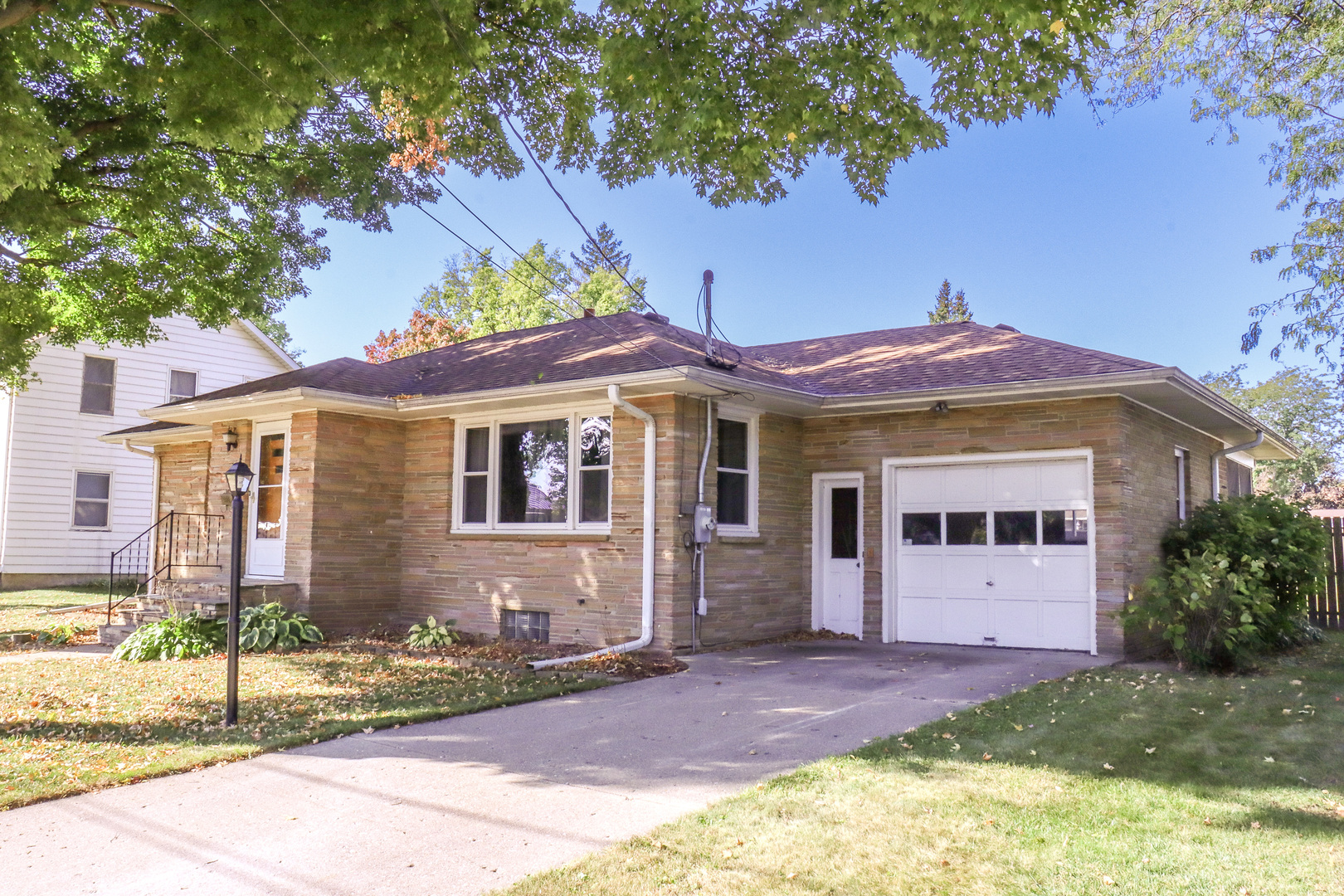 a front view of a house with yard