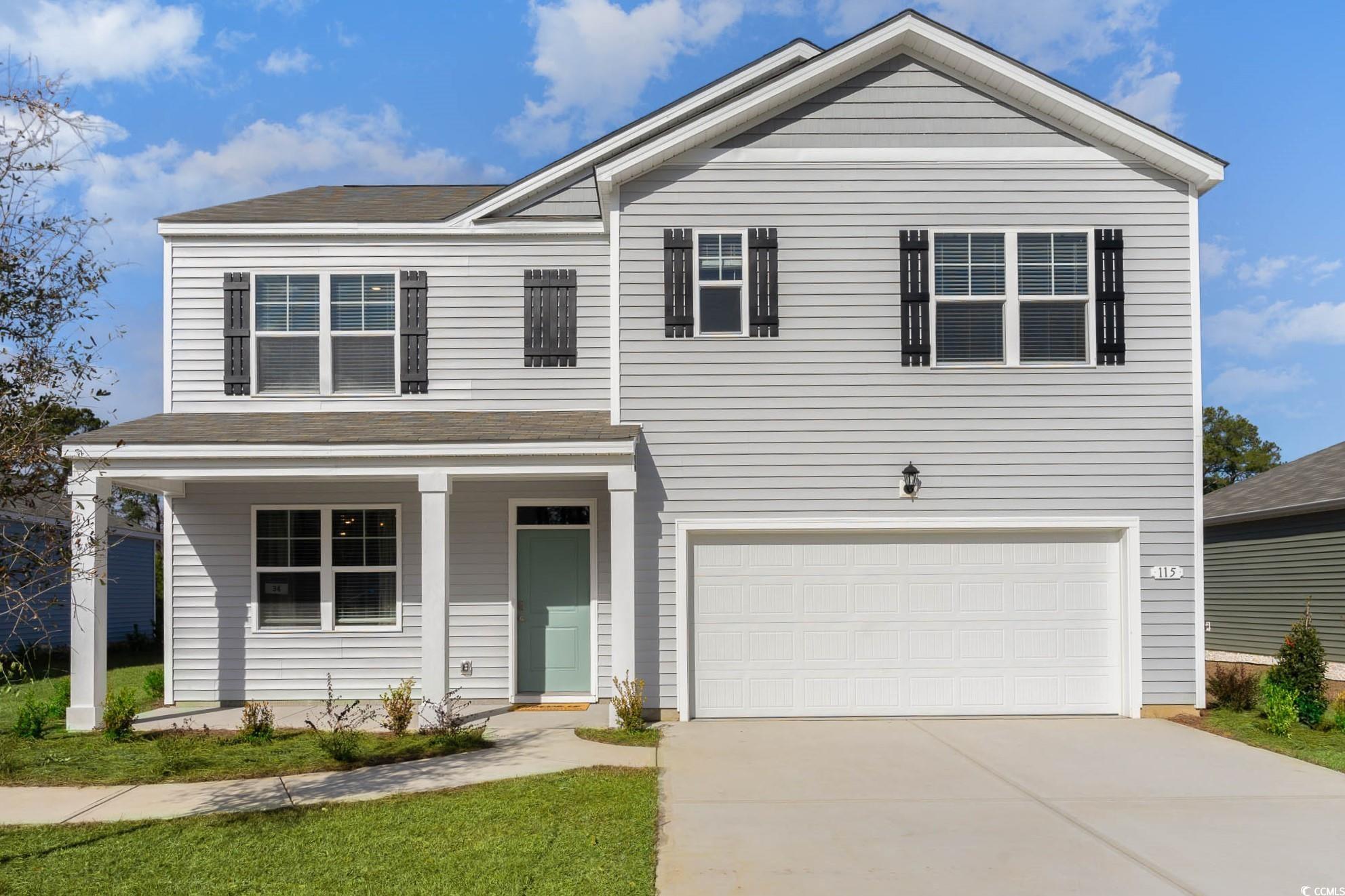 View of front of property with a garage