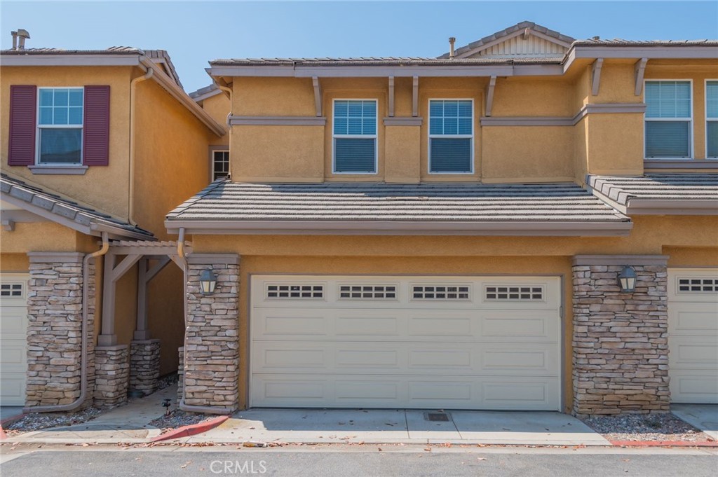 a front view of a house with a garage