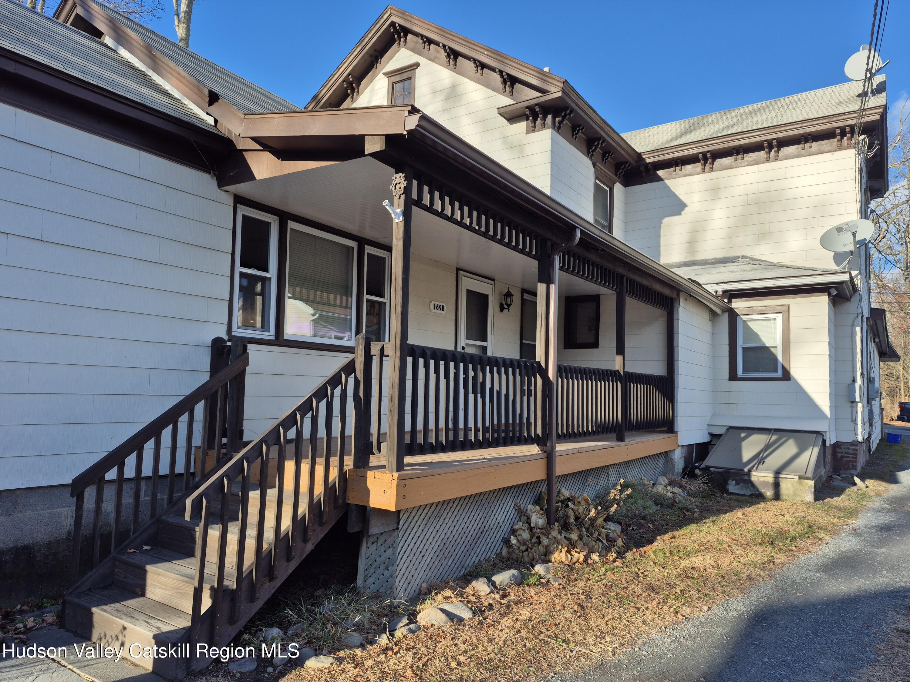 a view of a house with wooden stairs