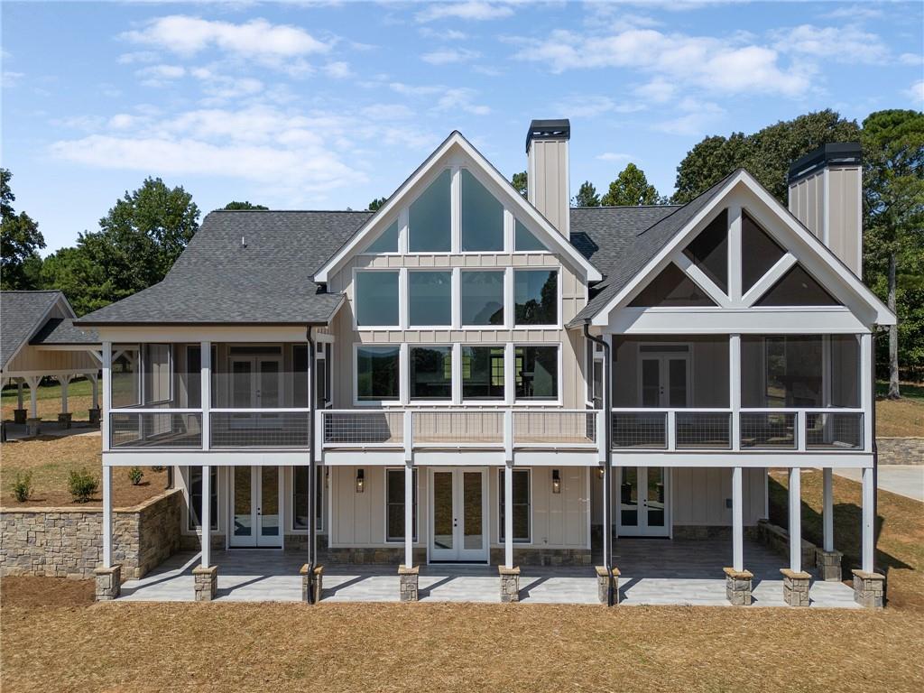 a view of a house with wooden floor and a yard