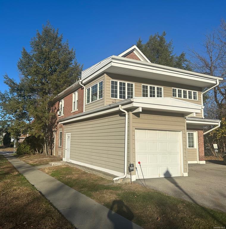 a front view of a house with a garage