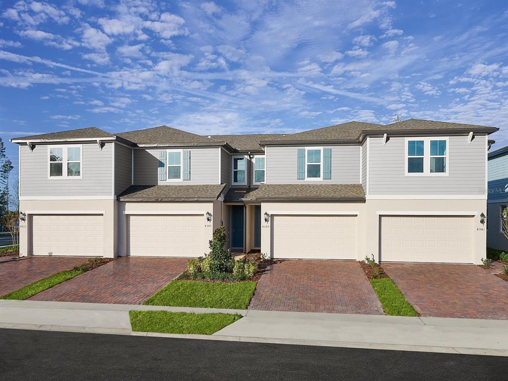 a front view of a house with yard