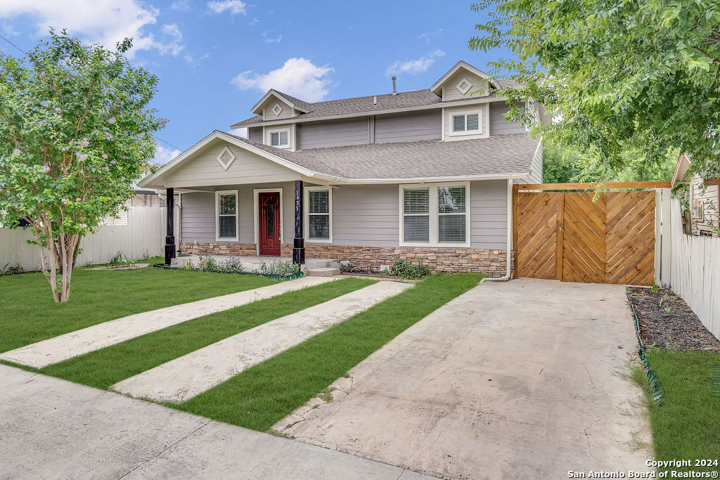 a front view of a house with a yard