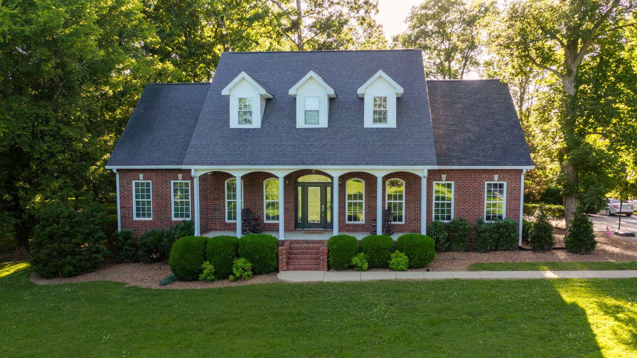 a front view of a house with garden