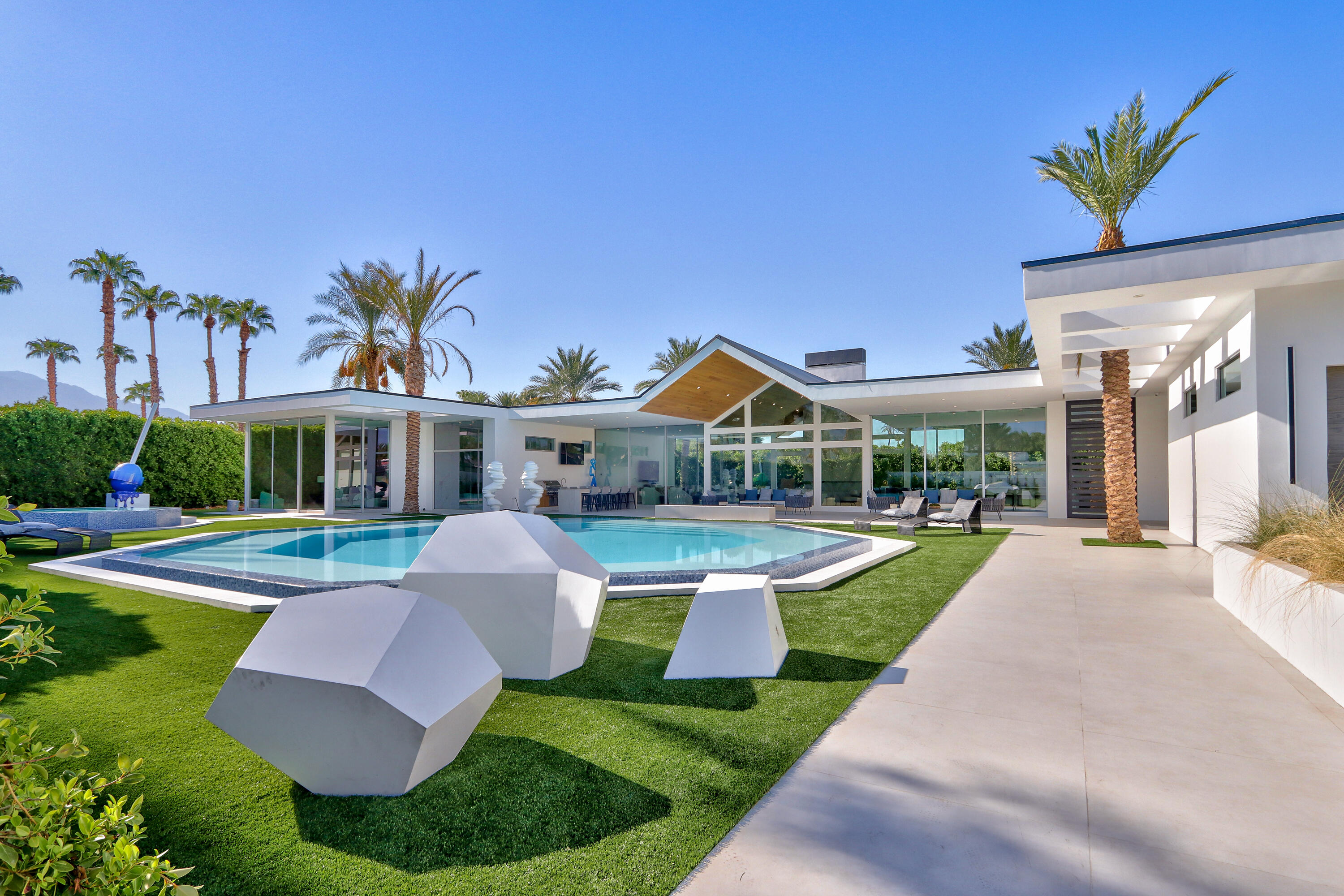 a front view of house with yard and outdoor seating