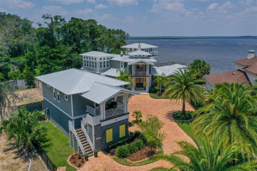 an aerial view of a house with a yard