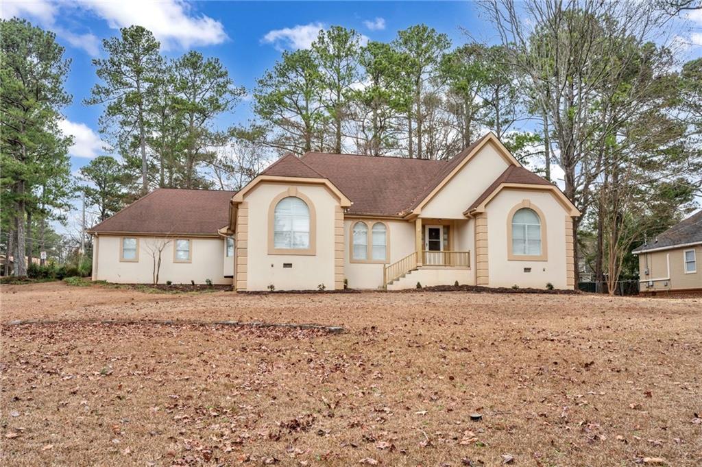 a front view of a house with a yard