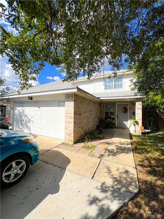 View of front property featuring a garage