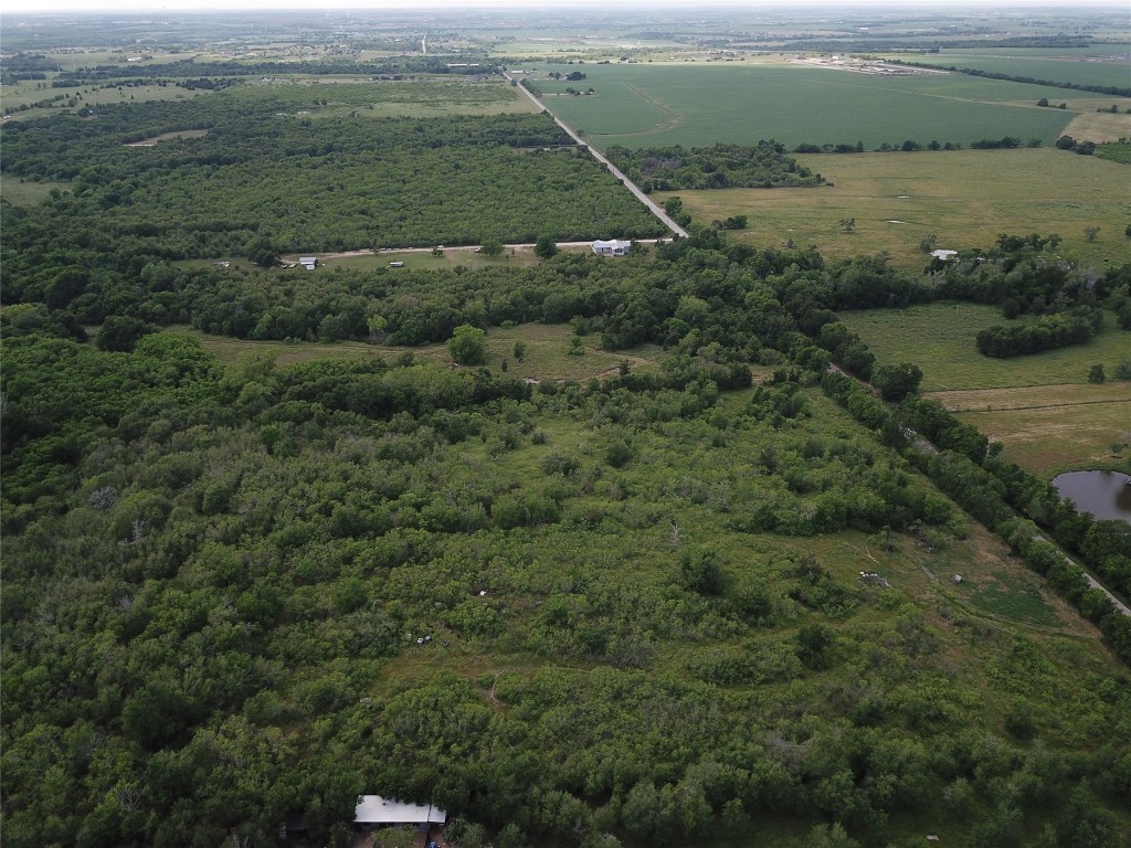 a view of a field with an ocean