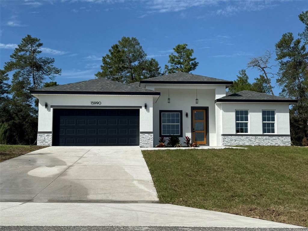 a house with lots of trees in the background