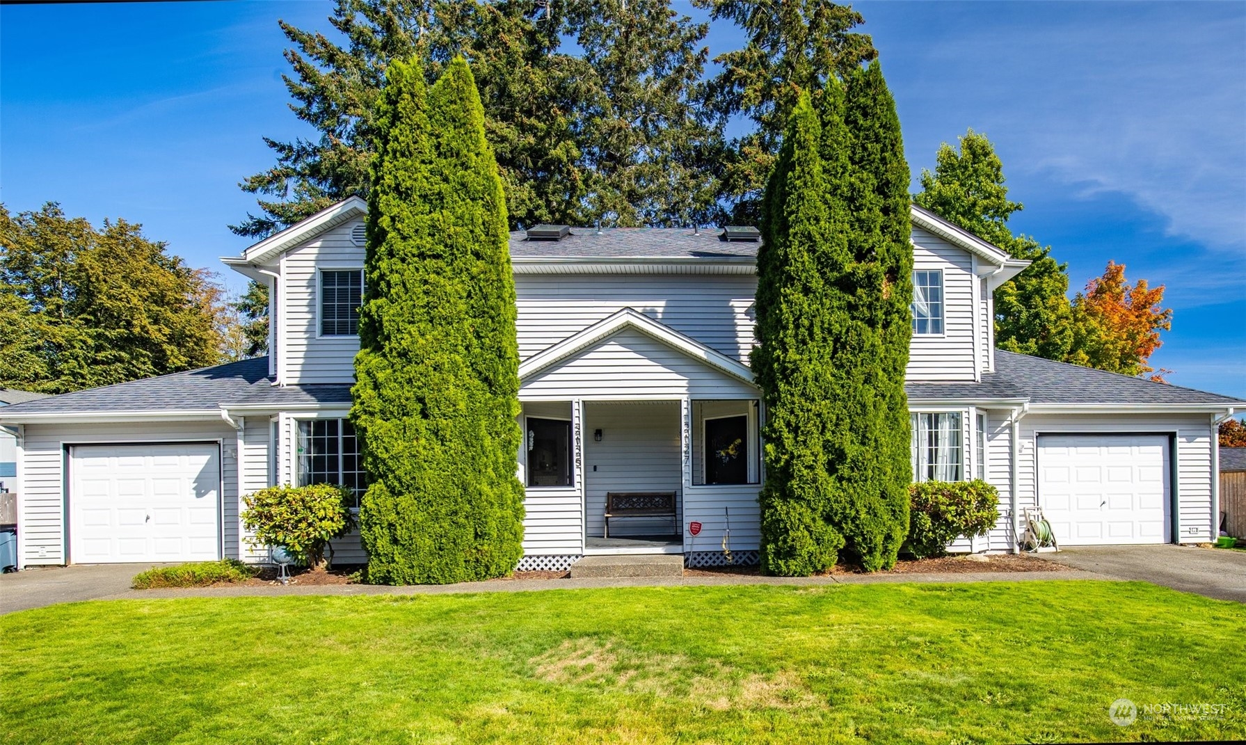 front view of a house with a yard