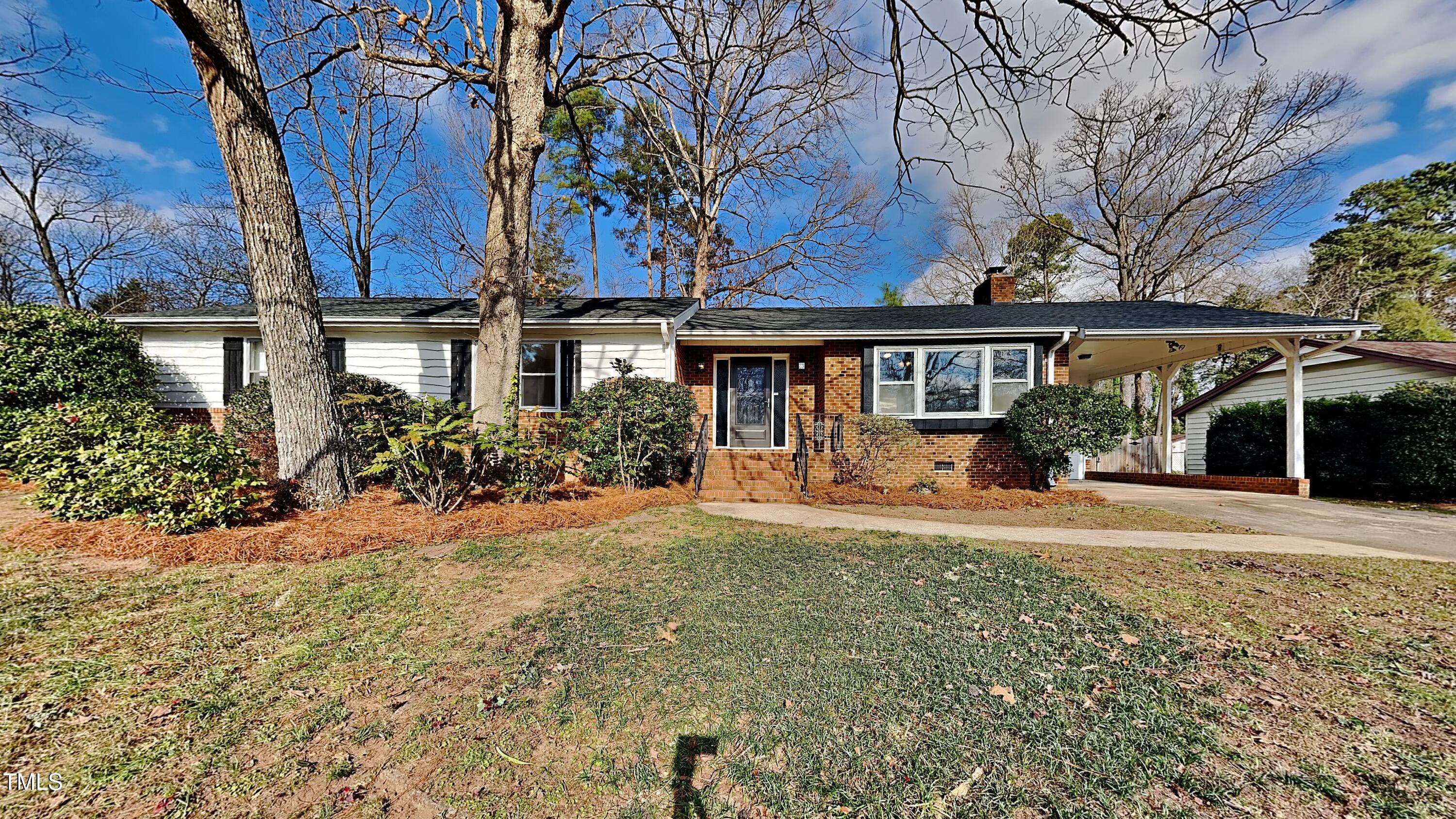 front view of a house with a yard