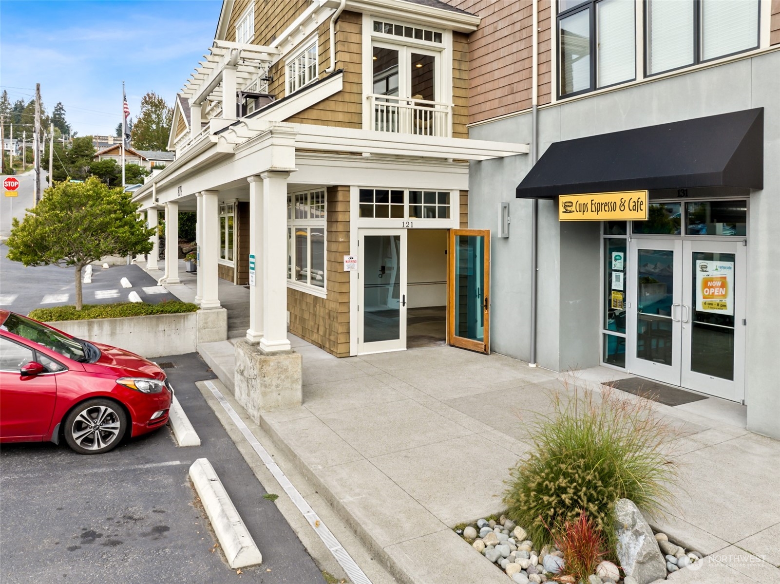 a front view of a building with parking space