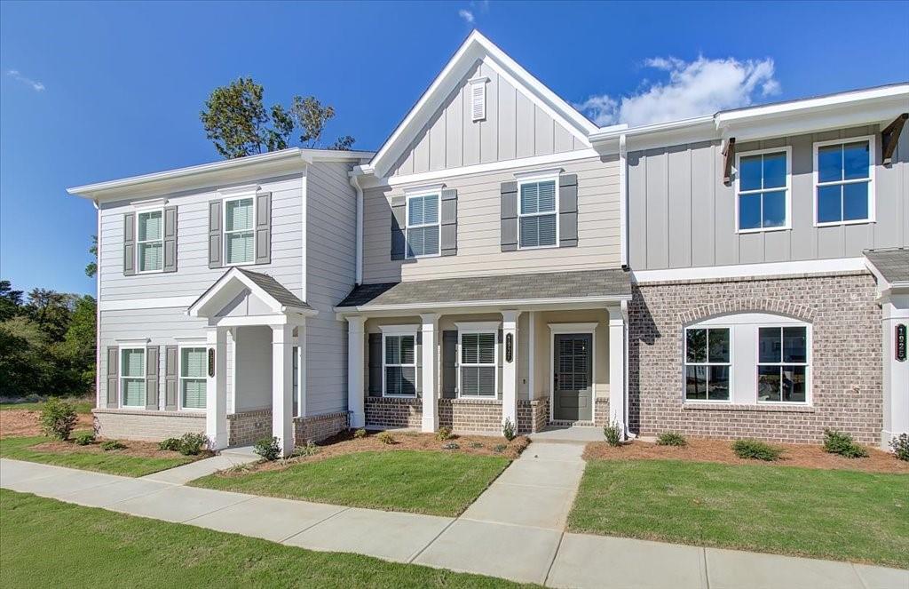 a front view of a house with a yard