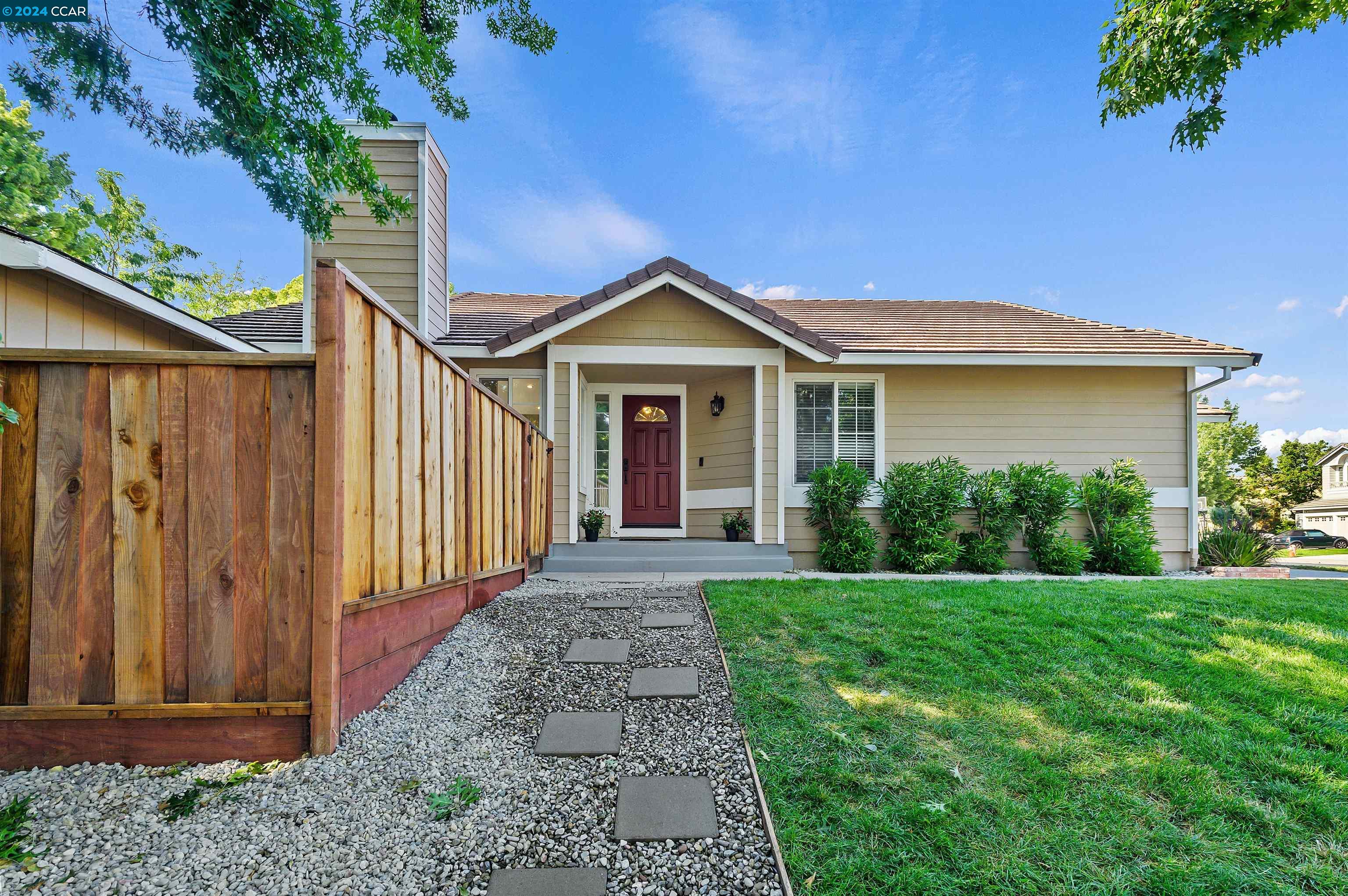 a front view of a house with yard