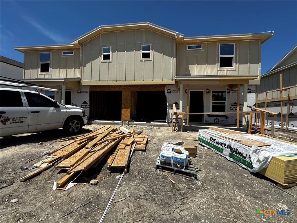 a view of a car park in front of house