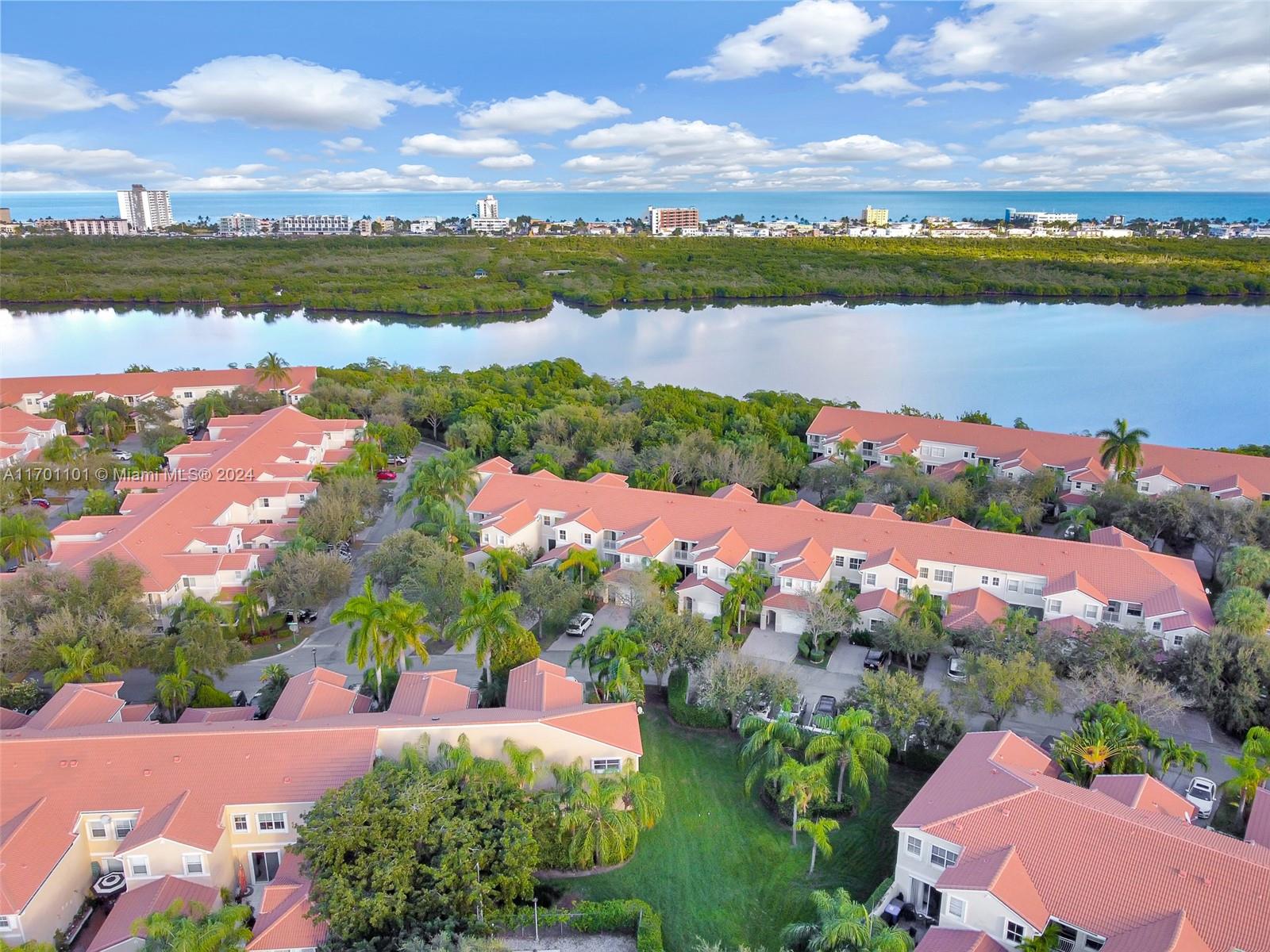 a view of lake with houses in the back