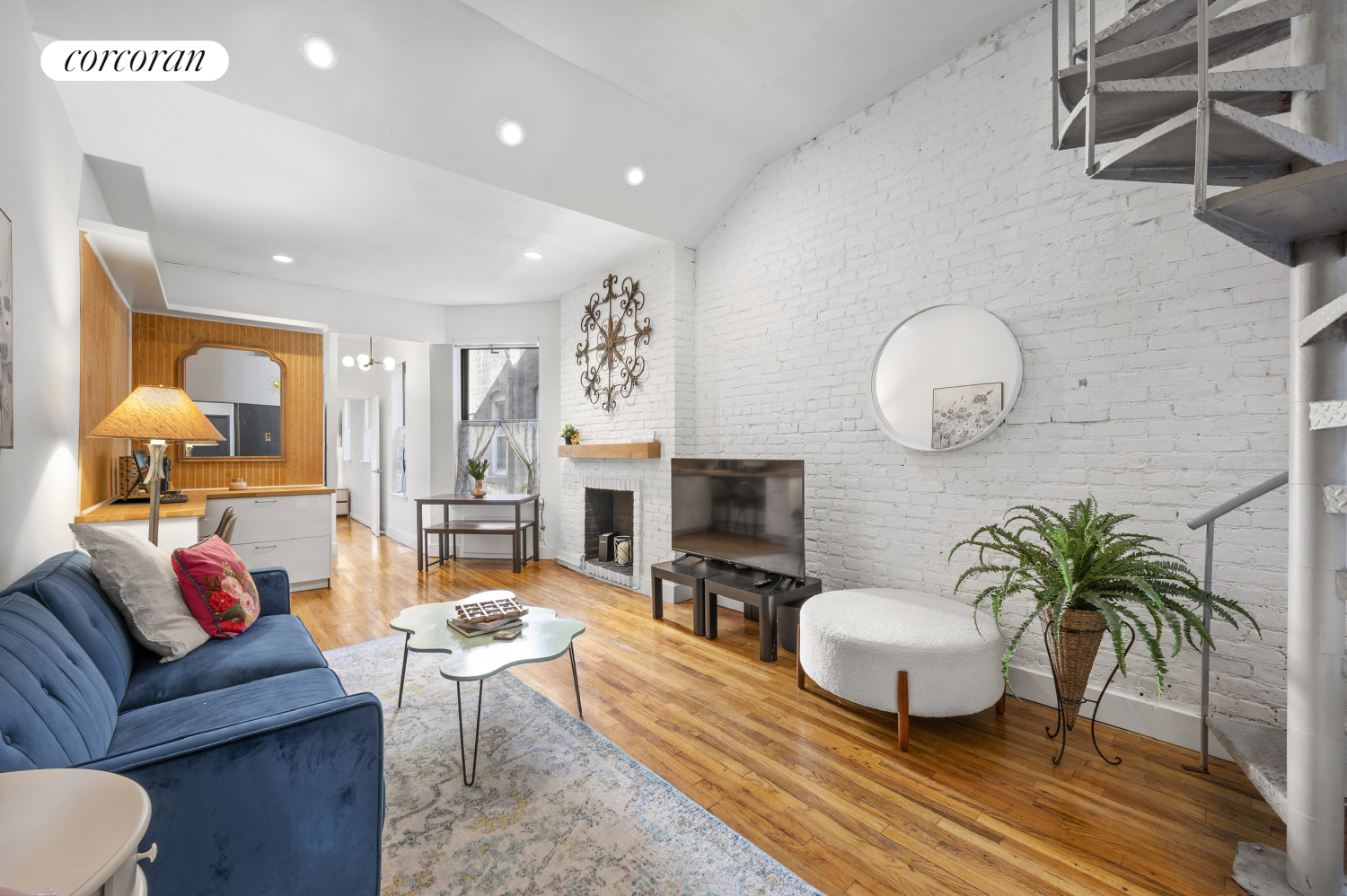 a living room with furniture a fireplace and a flat screen tv