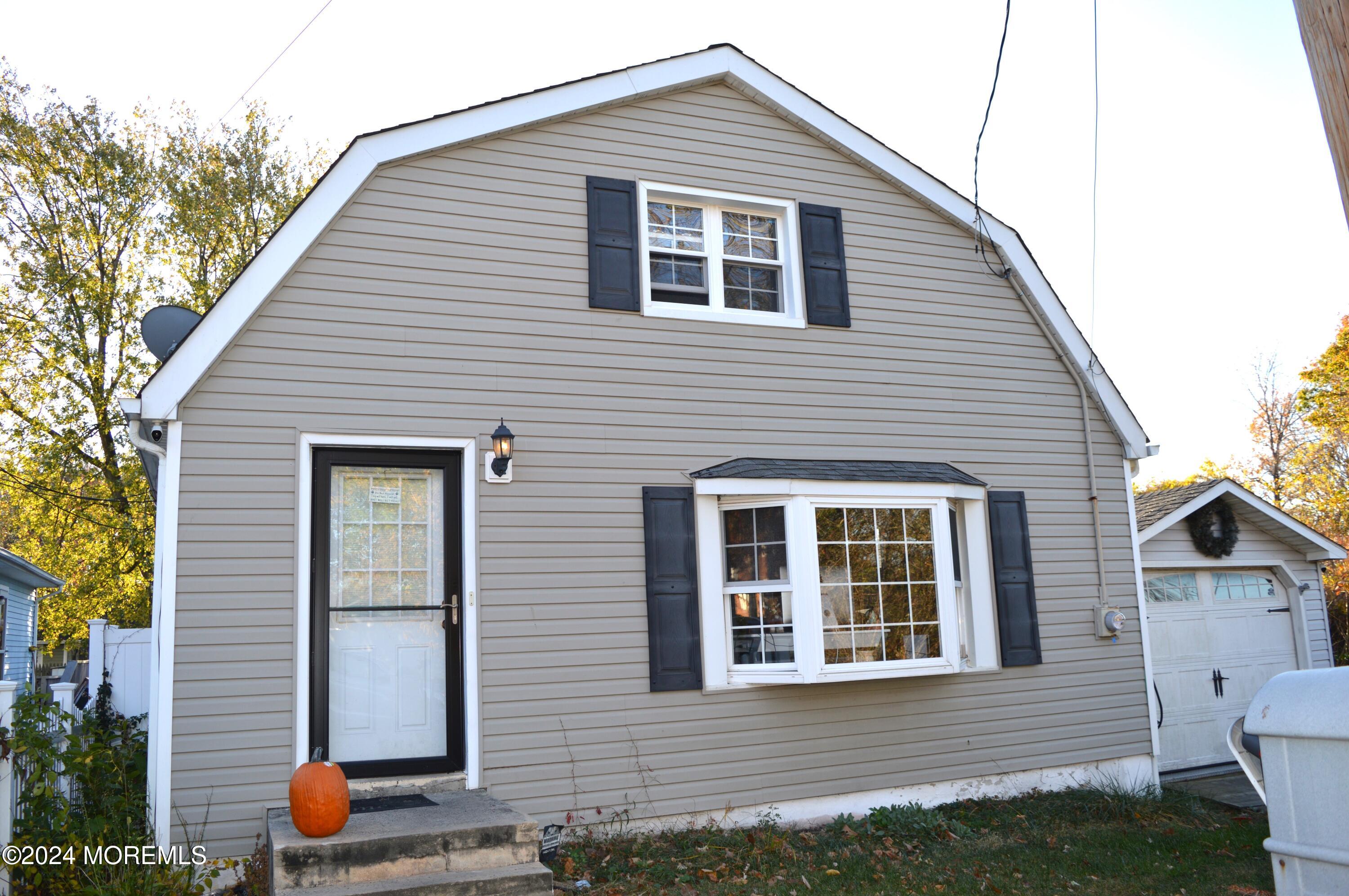 a front view of a house with outdoor space