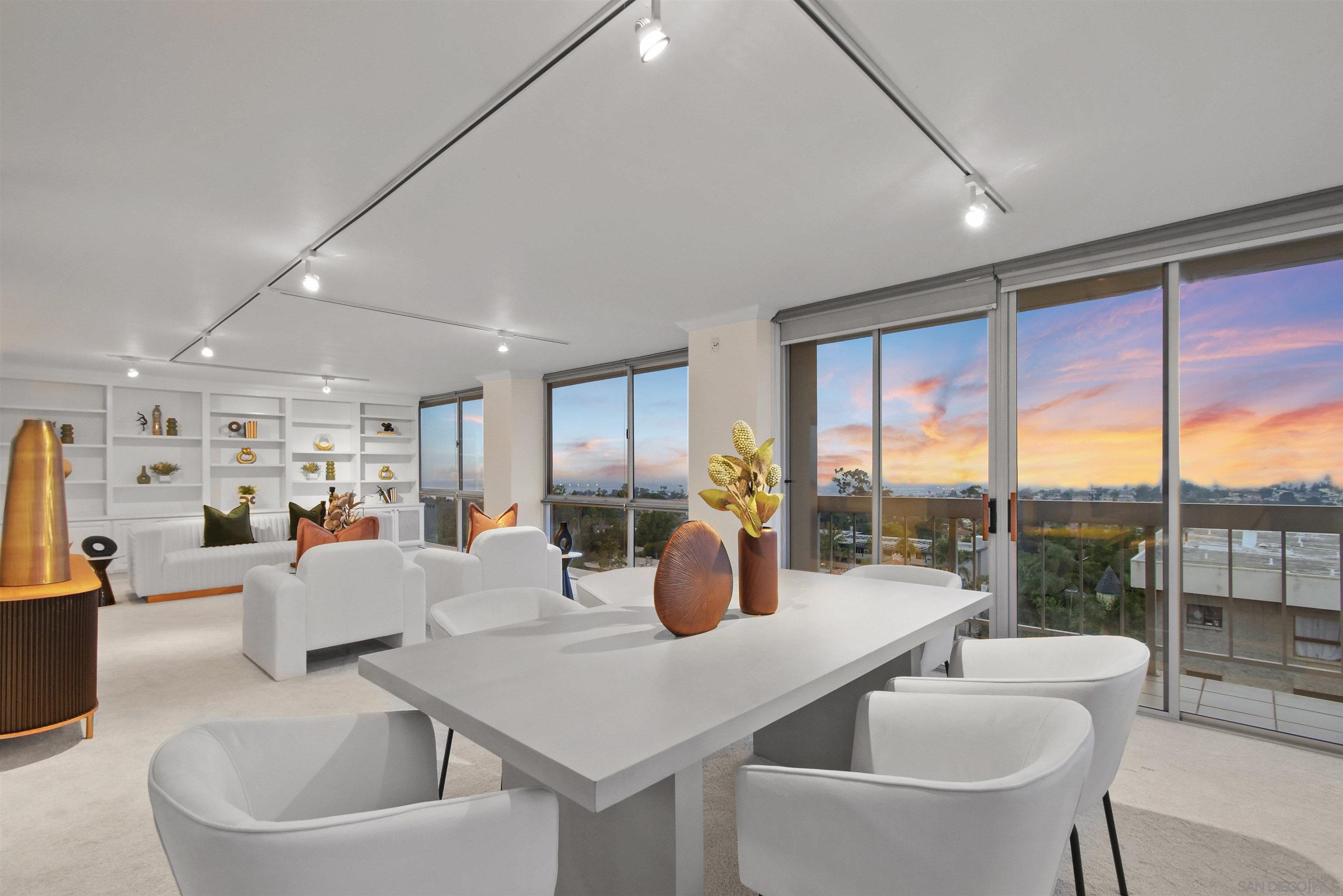 a large living room with stainless steel appliances