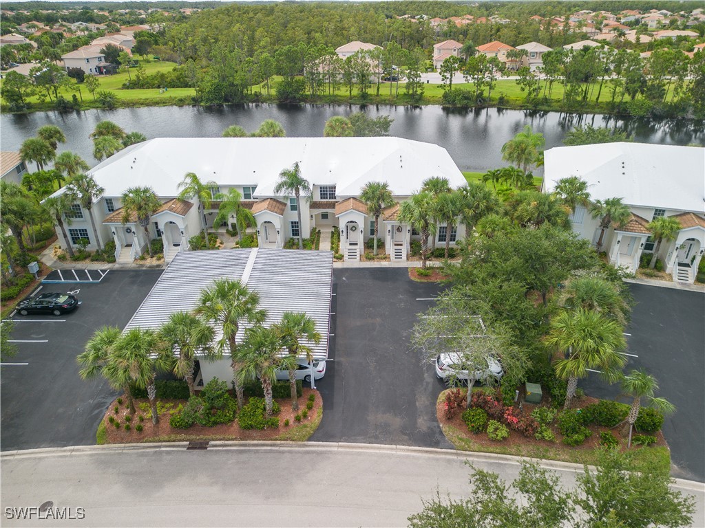 an aerial view of a house with a lake view