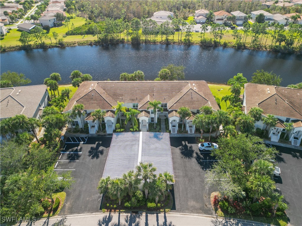 an aerial view of a house with a lake view