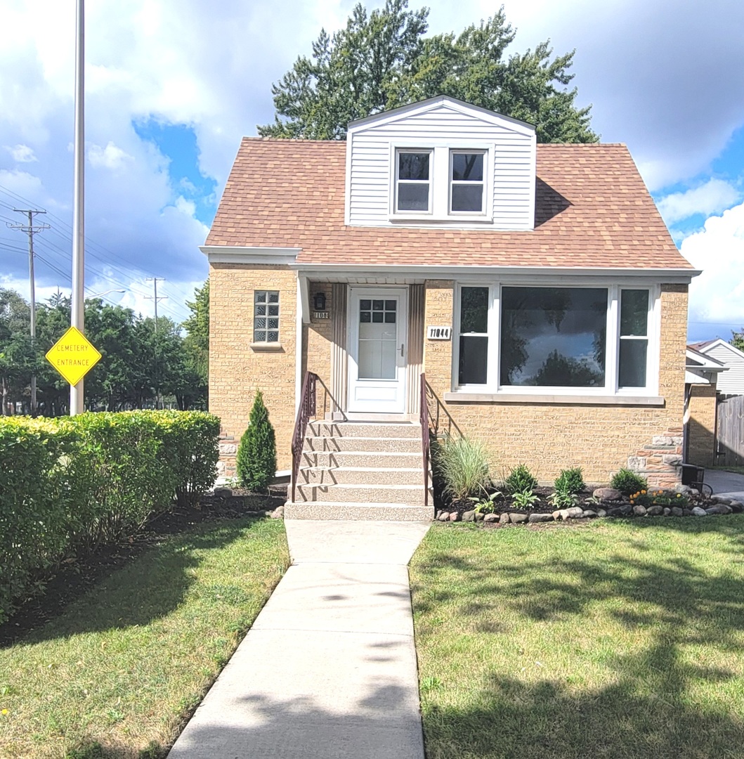 a front view of a house with a yard