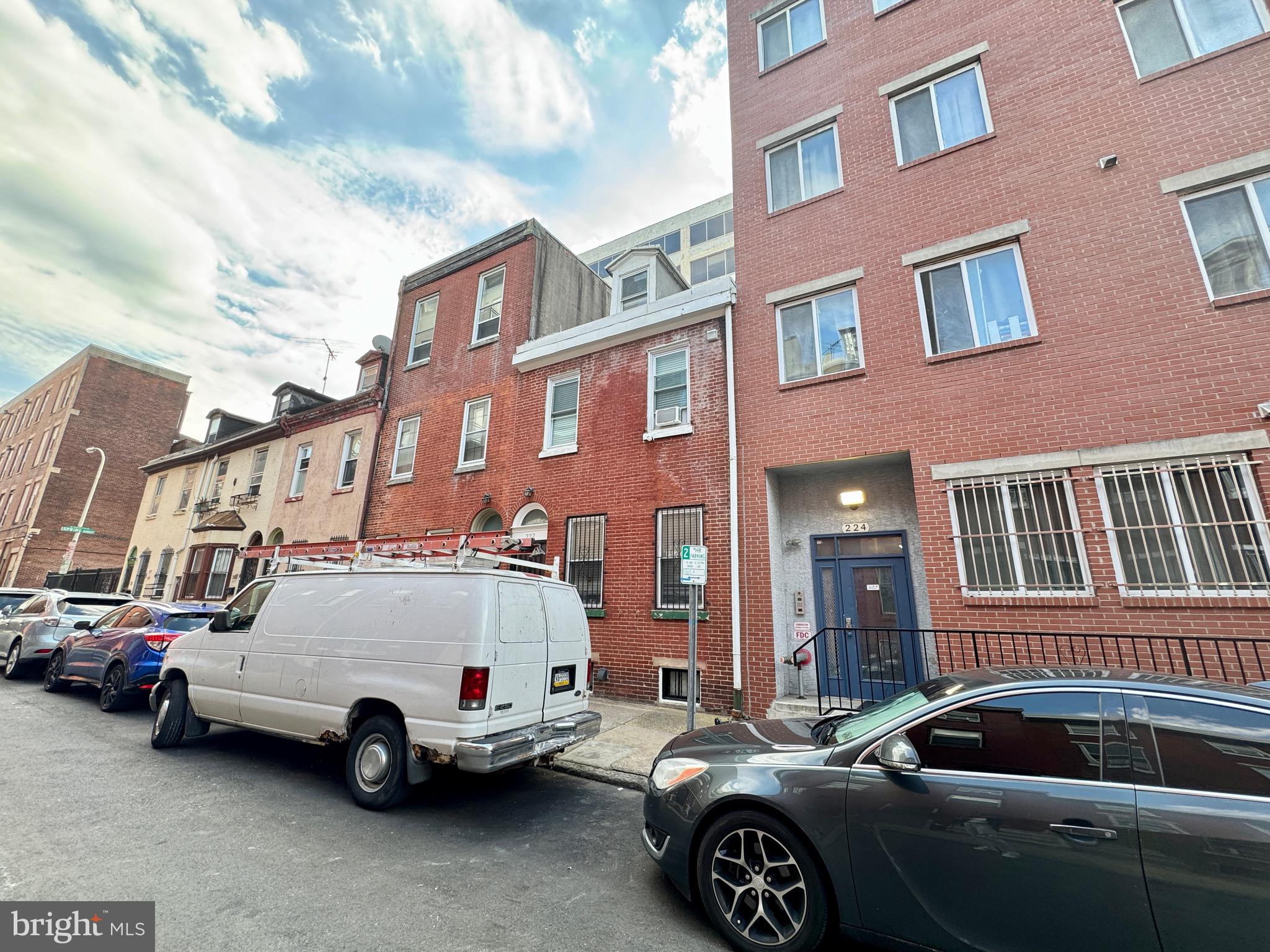 a view of a car parked in front of a building