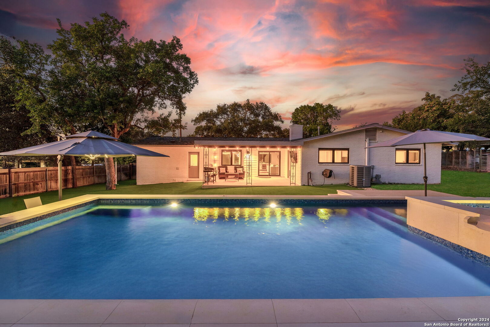 a view of a swimming pool with lounge chair