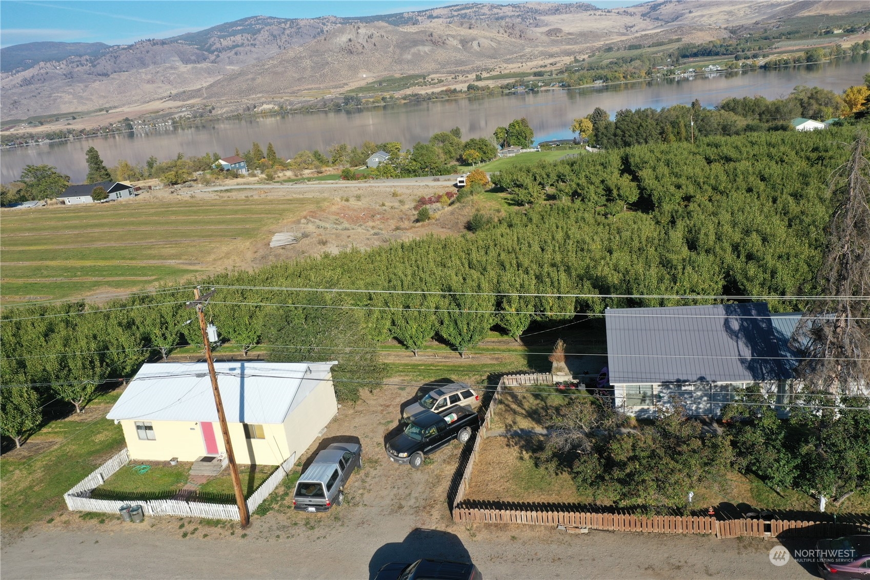 an aerial view of a house with a ocean view