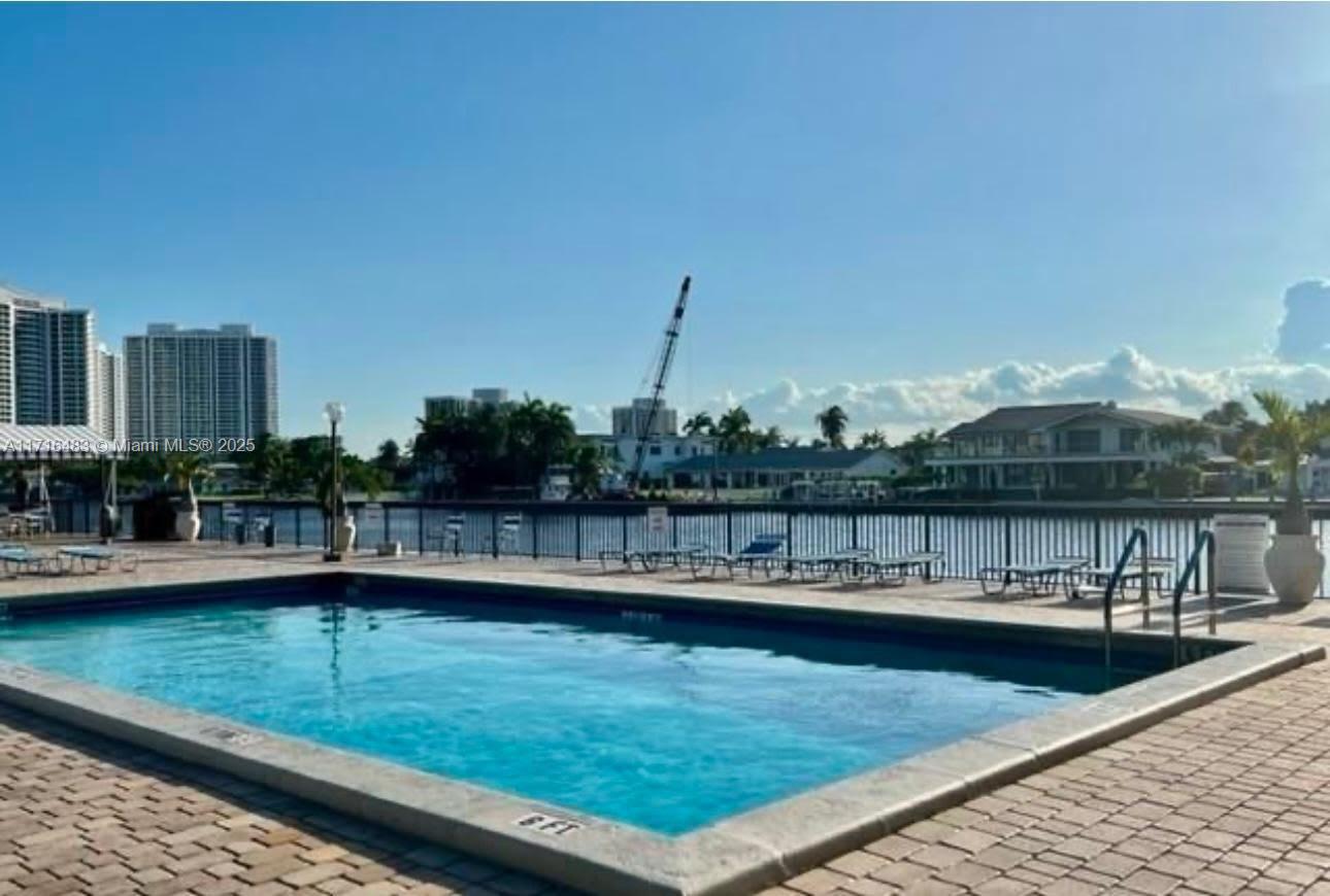 a view of swimming pool with a lake view