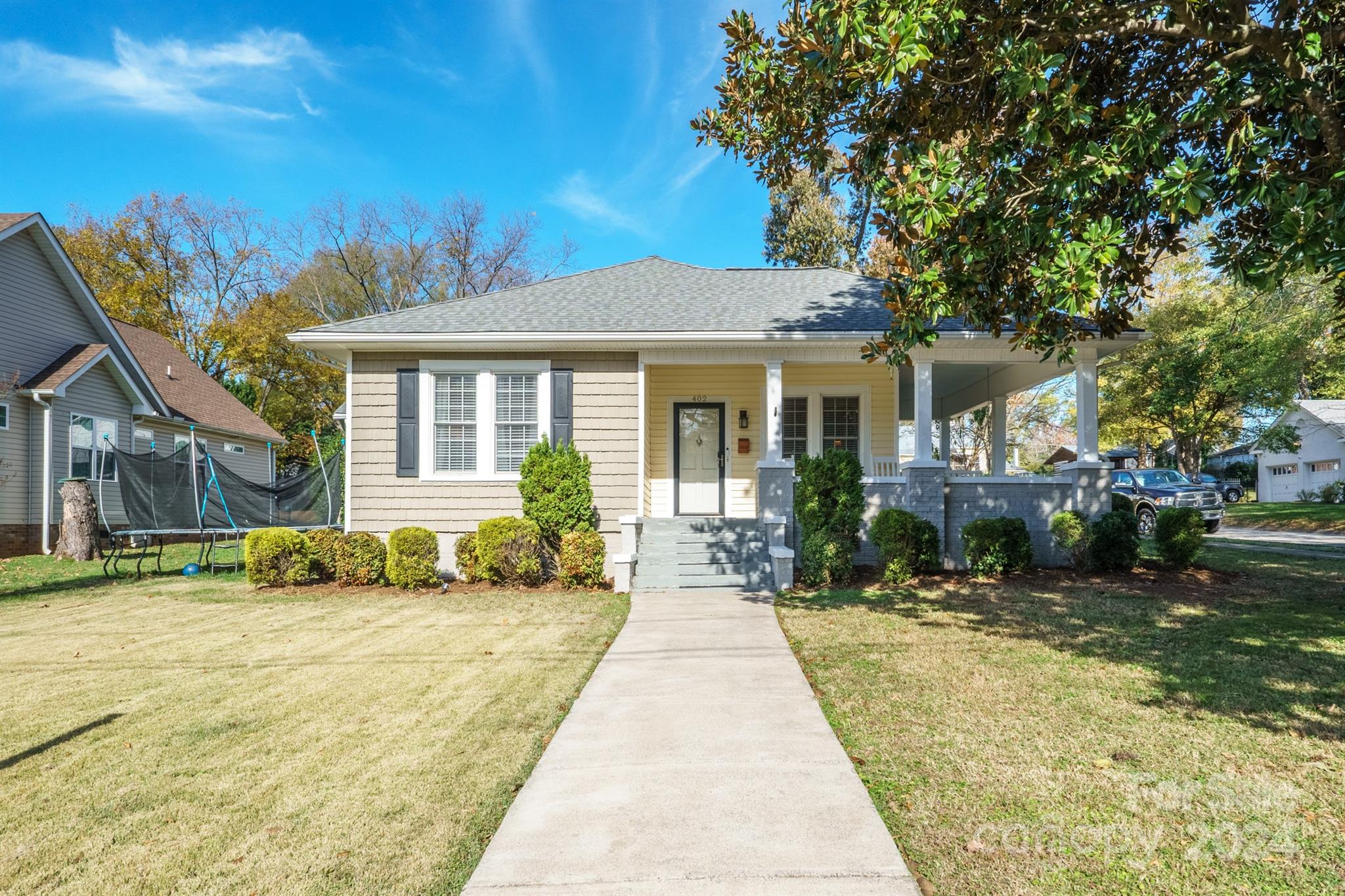 a front view of a house with a yard