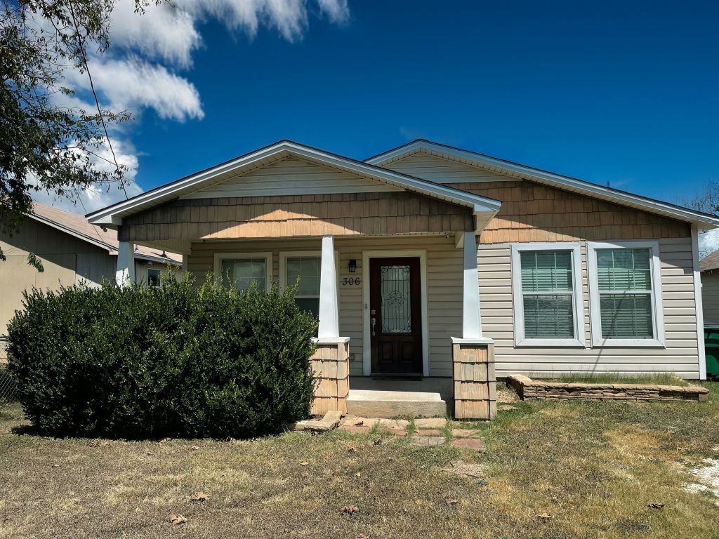 a front view of a house with yard